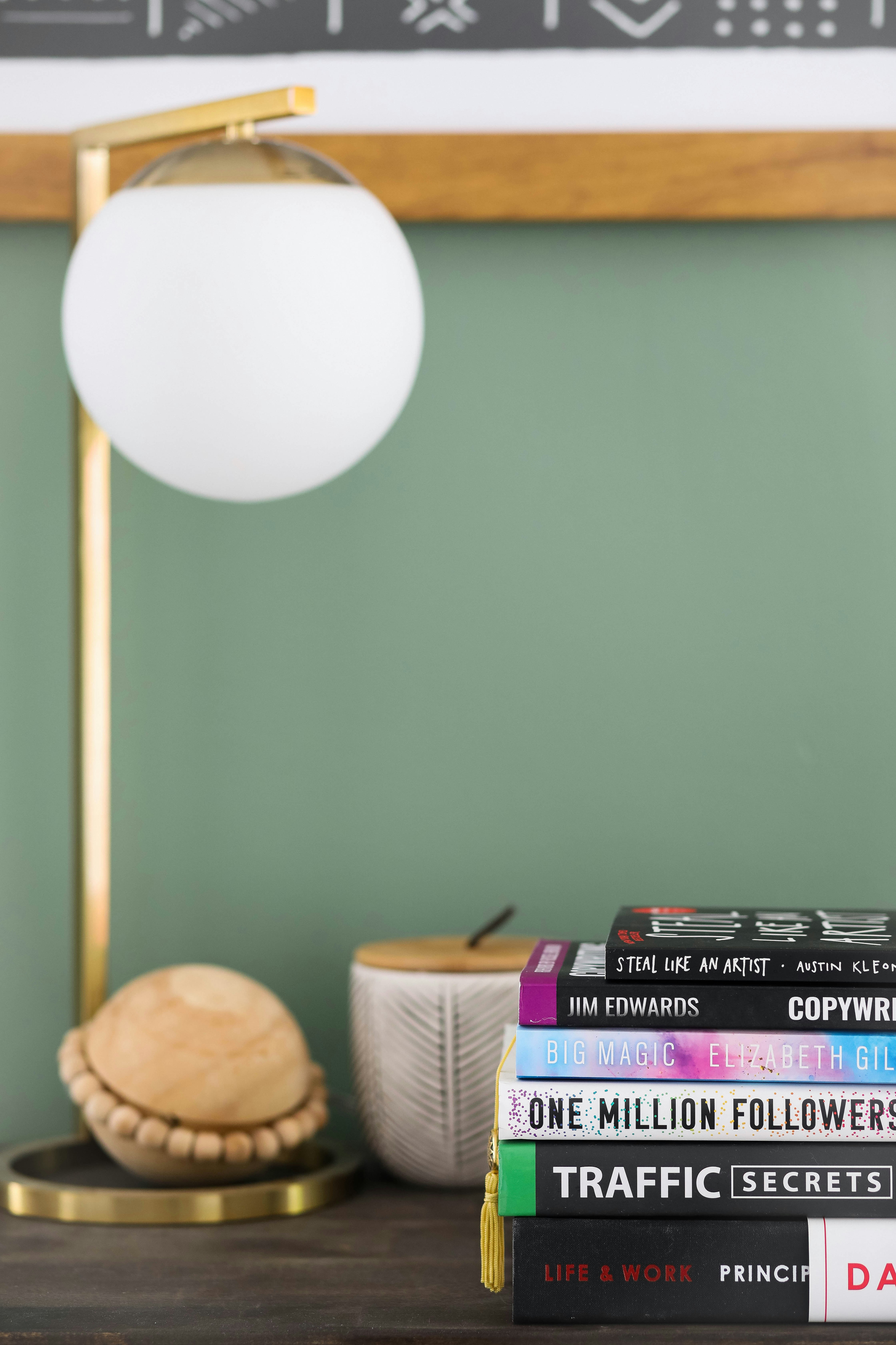 white round lamp near brown wicker basket